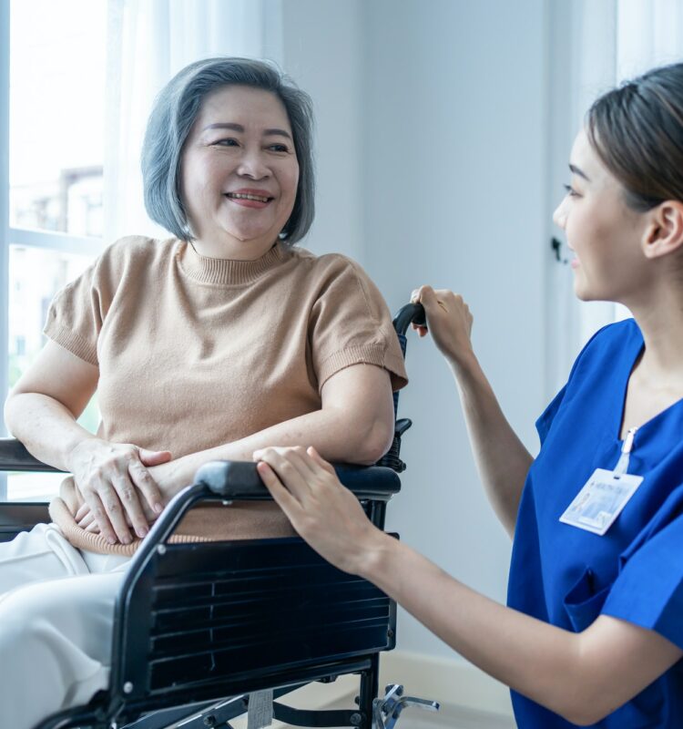 asian-nurse-take-care-senior-woman-on-wheelchair-at-nursing-home-care-